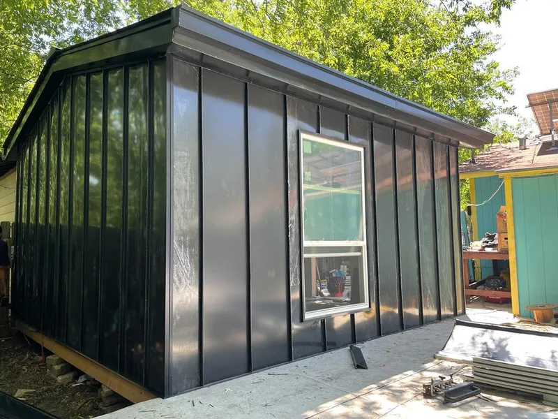 Black standing seam metal wall panels for Roof Inspection in Ecorse